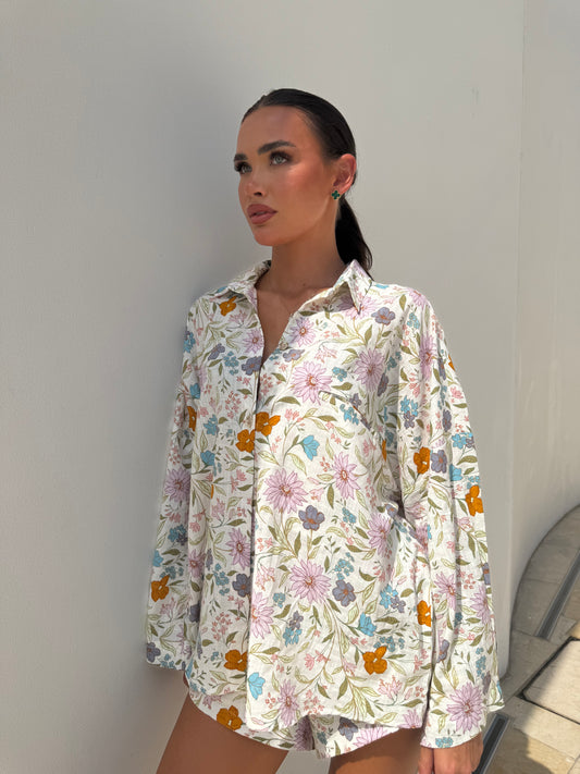Summer two-piece outfit with long sleeve shirt and high-waist shorts in pastel floral print